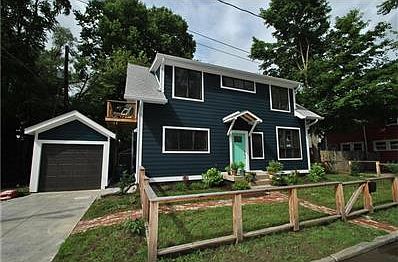 3 Bedrooms with 2 full baths; new from the foundation up in 2014/2015. Notice the large windows. They are all casement or awning style windows - great natural light throughout; just love it!
