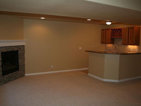 Wet Bar and Fireplace in Basement