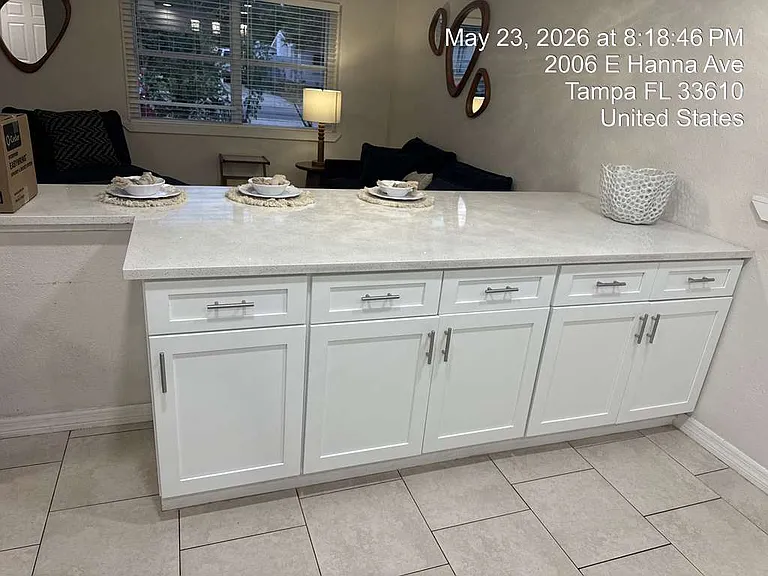 Spacious kitchen with ample cabinet space, stainless appliances, and pass-through to dining and living areas