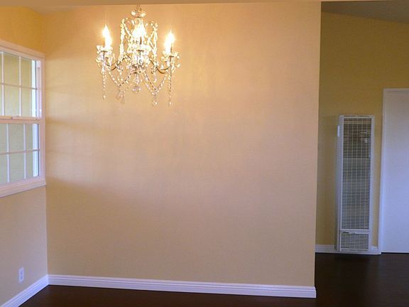 Dining Area with Chandelier and Front Yard View