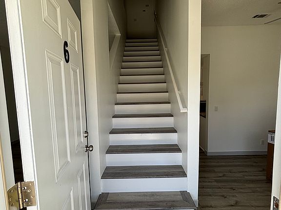 Entryway - stairs lead up to upstairs (2 bedrooms, one bath and laundry hookups upstairs)