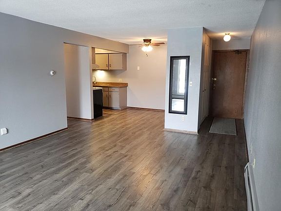 View of entry and kitchen eating area. Large closet in entry