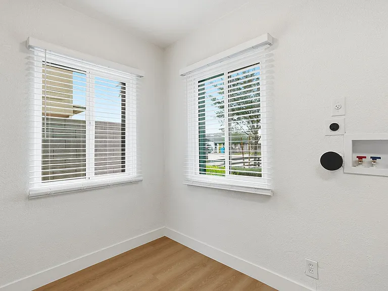 Beautiful designated dining area has lots of natural light. Washer and dryer hooks ups available.