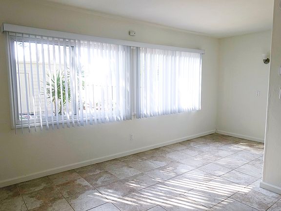 Dining Area / Living Room; stock photos of a similar unit.