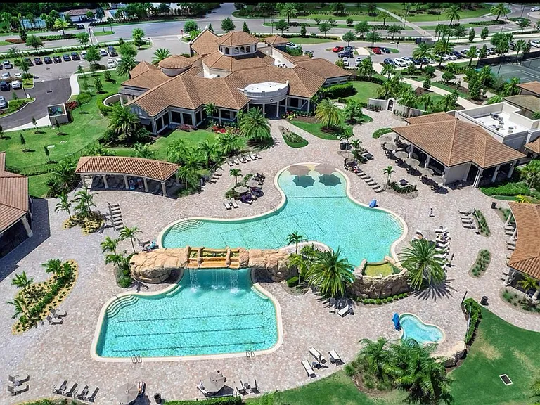 Club heated pool w adjacent bar and restaurant