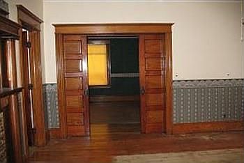 A view of the original pocket doors between the livingroom and the parlorfamily room, which is 15.1 