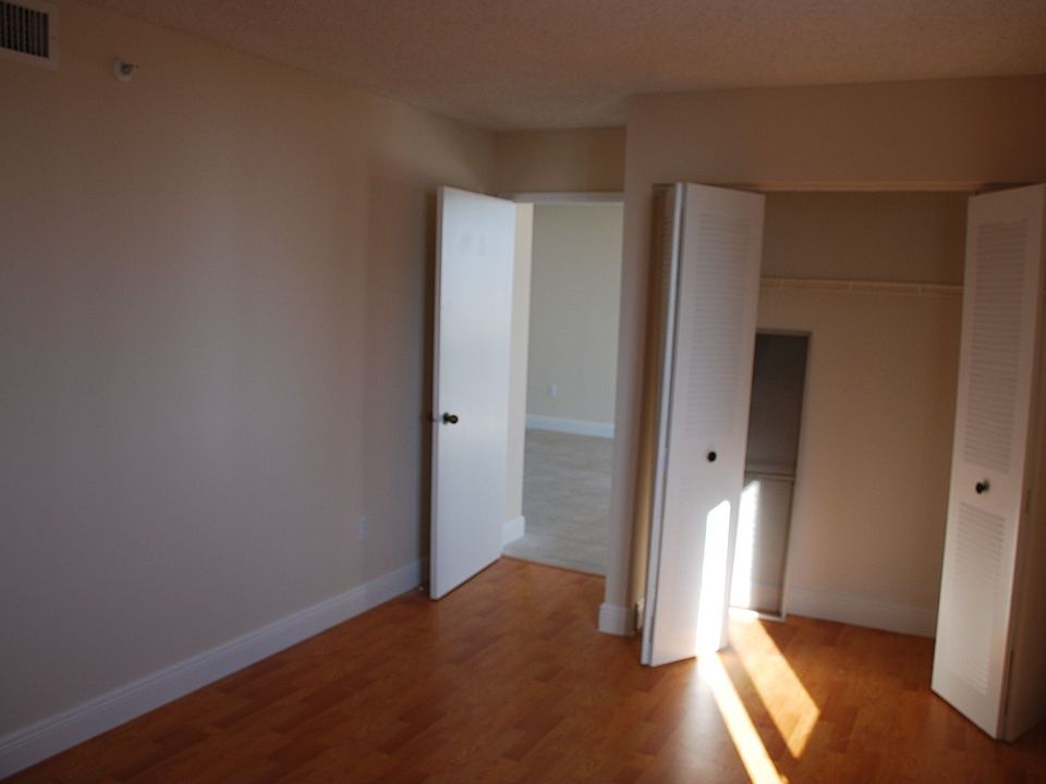 Laminated wood floors in bedrooms, split bedroom floor plan