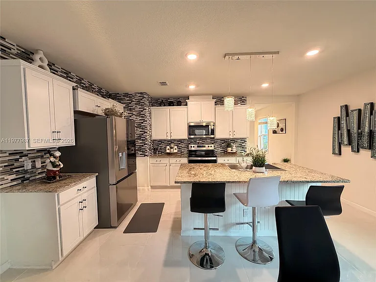 12422 SW Rimini Way — Photo 7