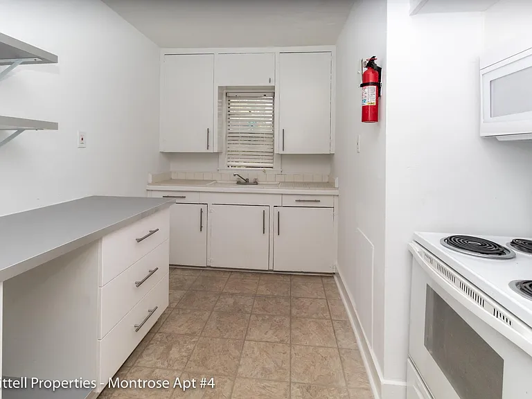 Kitchen has great storage option and plenty of countertop space.