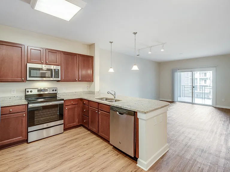 Select homes feature wood-style flooring throughout the living space
