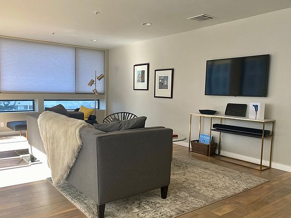 Living area with TV and Sonos sound system. High speed internet and all utilities included