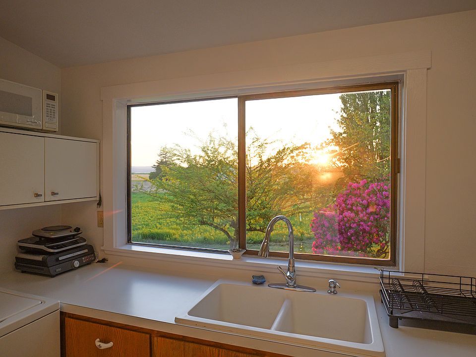 kitchen with sunset views of garden/fruit trees