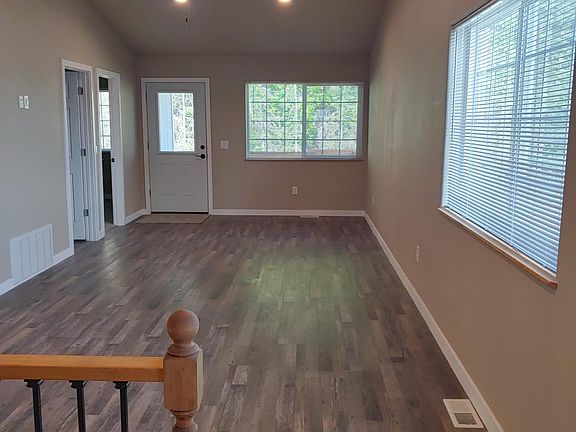 Walk in to the Living/Dining Room. Door leads out to Covered Balcony.