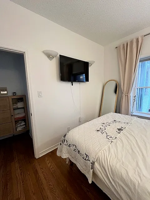 Other side of Bedroom. Includes smart TV. - W Buena Ave