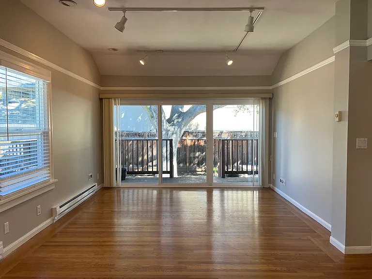 Living room, new patio door to balcony and backyard