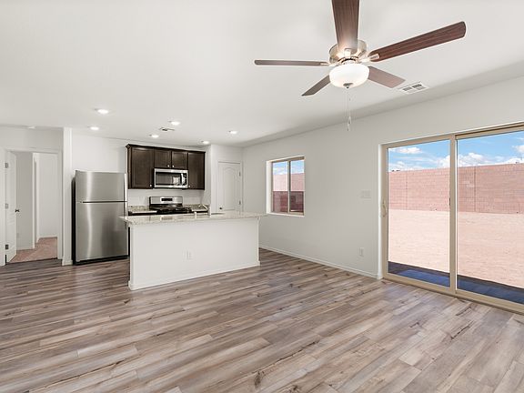 The kitchen opens up the the family room and backyard