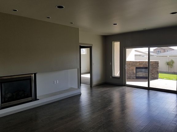 Great room with gas fire place, patio leads to outdoor gas f