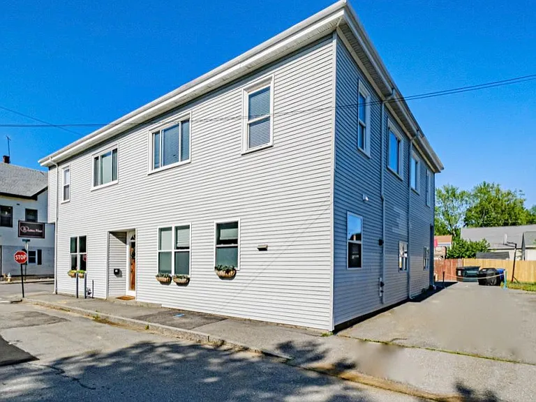 Two parking spaces go with the apartment on side of building