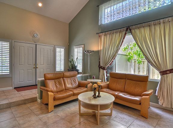 Step down formal living room with tile flooring