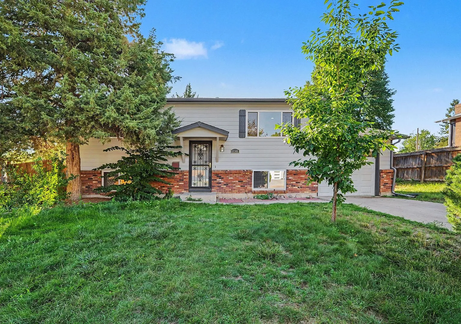 Spacious 3BR/2BA Centennial Home with Finished Basement & Extra-Large Fenced Yard — Photo 1