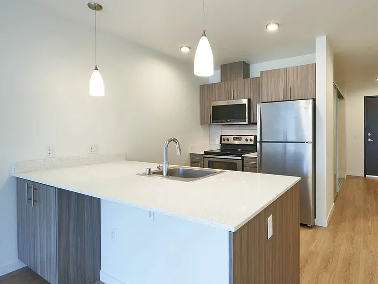 Kitchen with Breakfast Bar and Stainless Steel Appliances