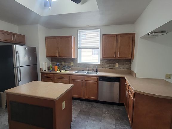 Lots of cabinets & a bar area in the kitchen