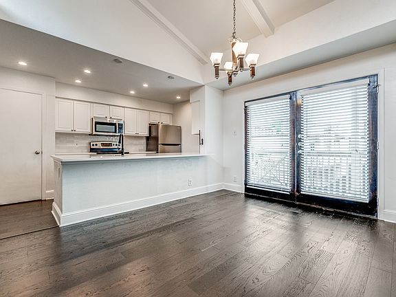 This is the view of the completely opened up kitchen area with granite countertops.