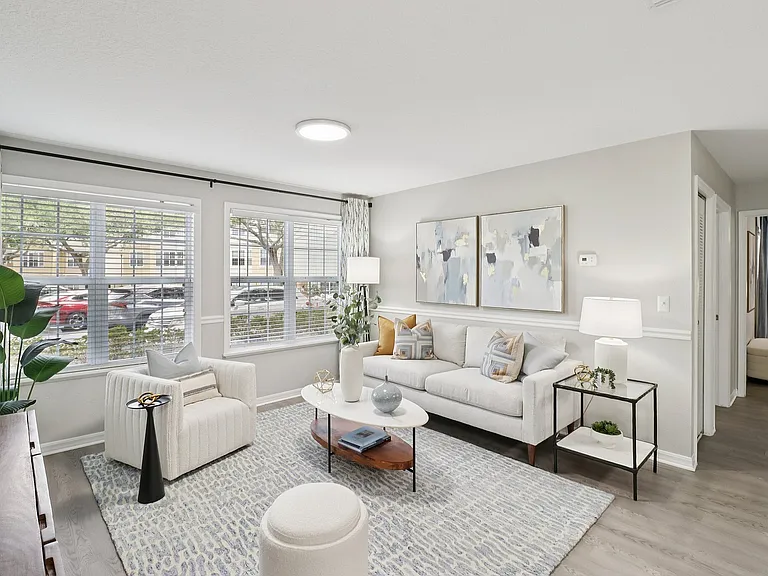 Bright living area with expansive windows and open layout