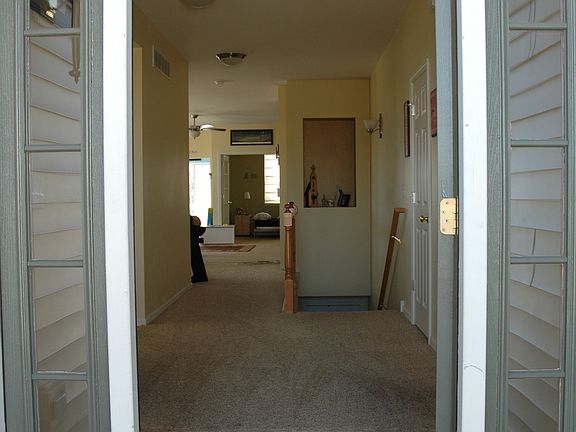 view from front door, open floor plan, you can see to rear of home