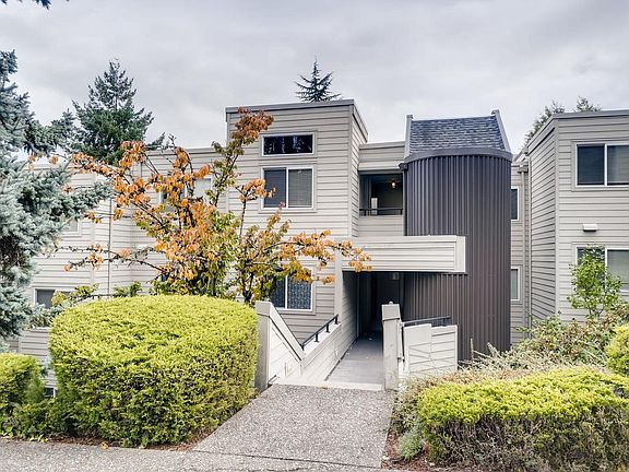 Entrance into the stairwell. Unit is on the top floor with the extra window above.