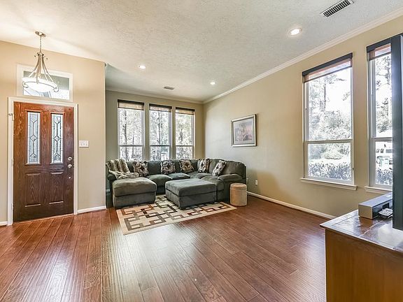 Formal Living and Formal Dining include abundant windows overlooking the front and side yards.