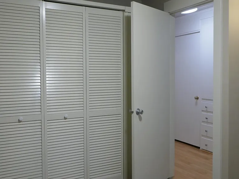 Bedroom with full closet - fits queen bed with bedside furniture. NOTE: The unit no longer has carpet in the bedroom, it is now hardwood laminate (much better!)