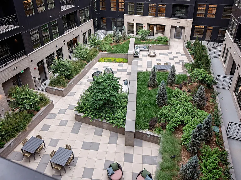 Well-manicured outdoor courtyard with social seating