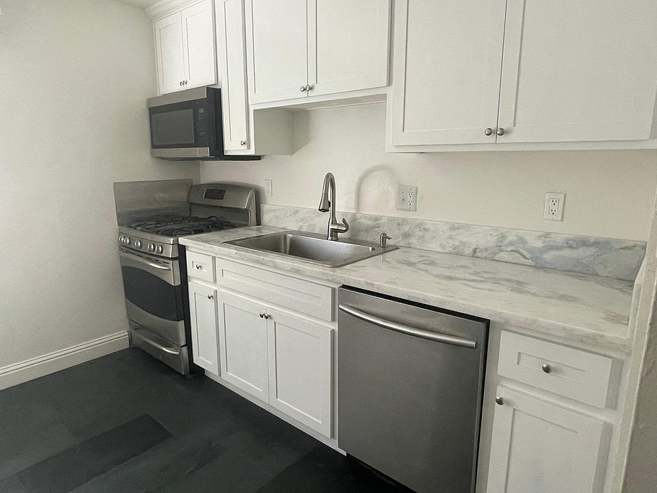 custom kitchen with stainless appliances