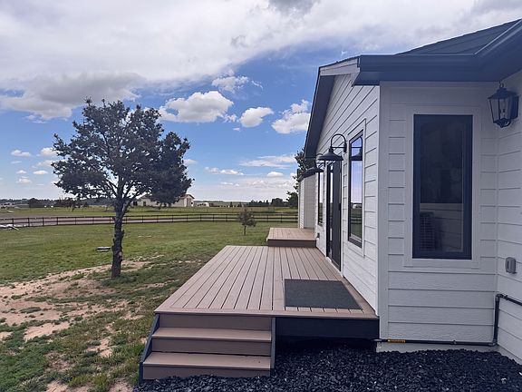 Deck off sliding glass door of living room.