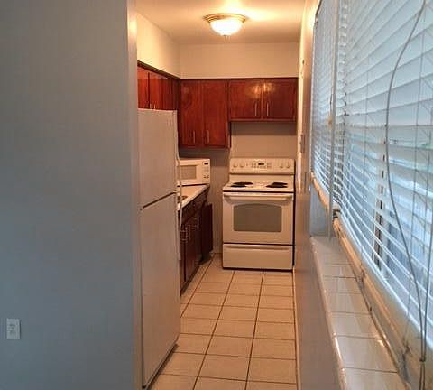 Kitchen cabinets have been replaced and are white