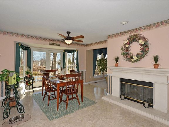 This is the breakfast room with See Through fireplace. The atrium doors and bay windows add a delightfulsurround for that gorgeous view of the golf course.
