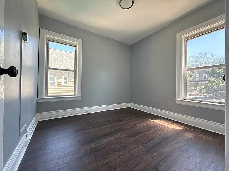 Bedroom 1 with 2 windows and 1 closet