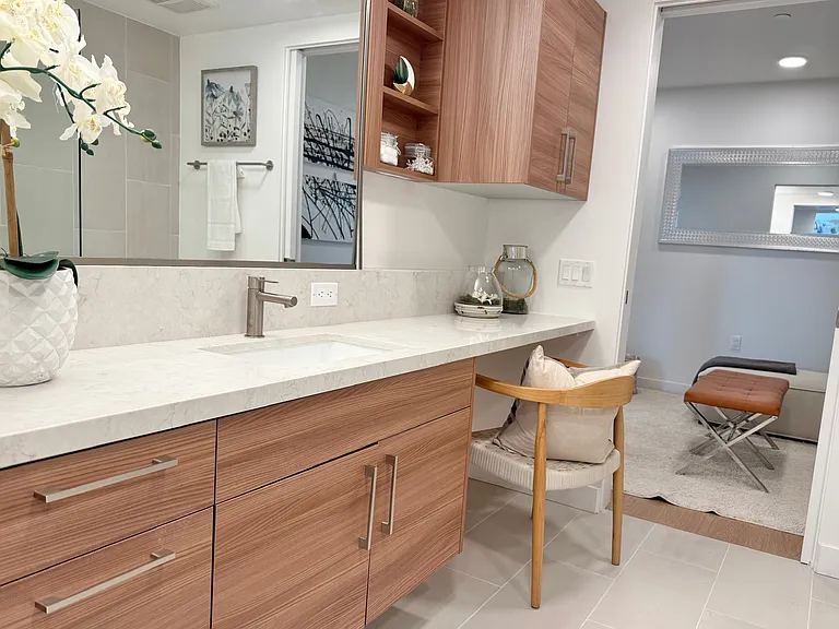 Spa-inspired bathroom offers a calming retreat with its open floor plan, premium stone surfaces, and beautiful appoined fixtures.