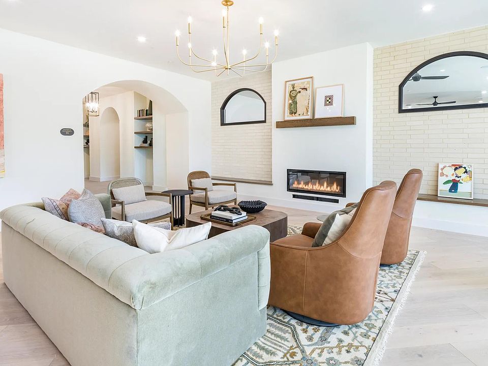 Brighlty lit resident lounge with ample social seating.