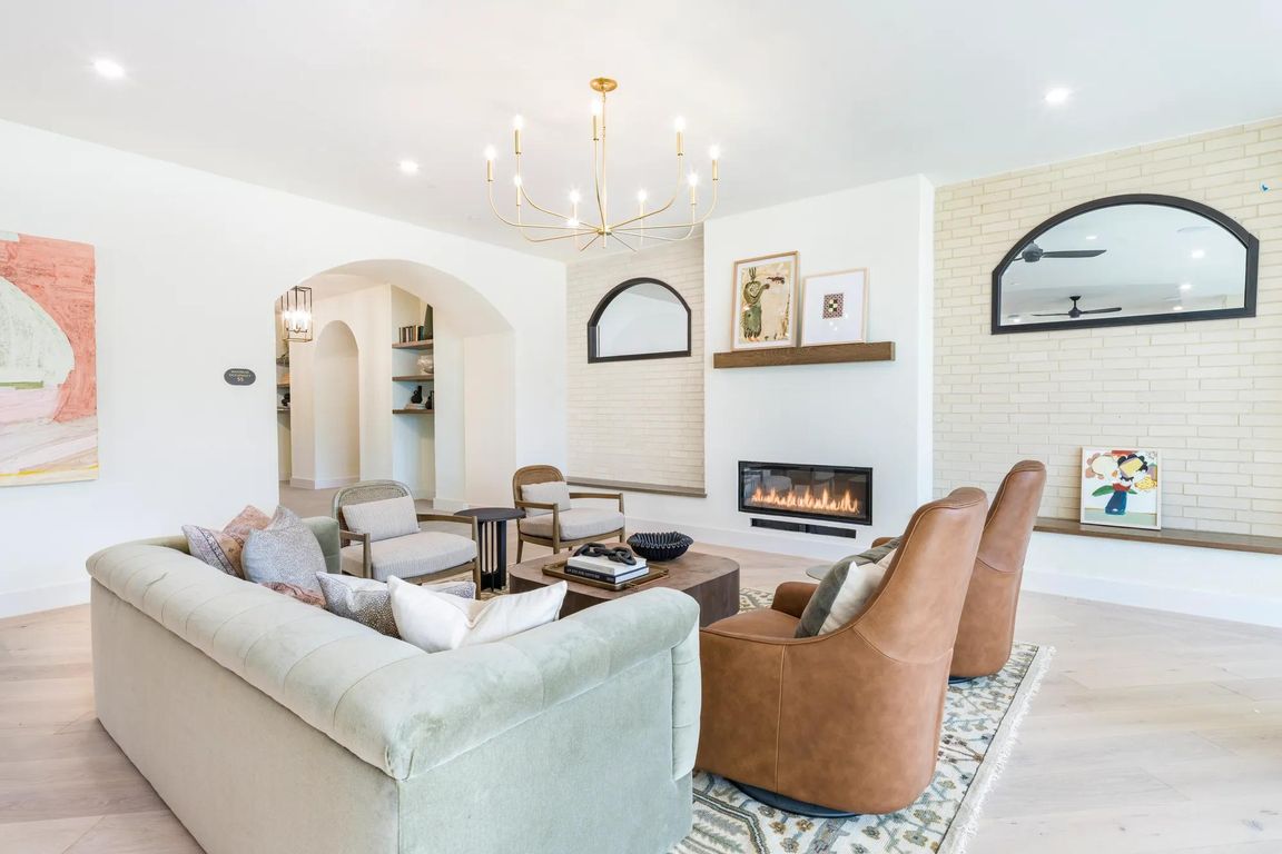 Brighlty lit resident lounge with ample social seating.