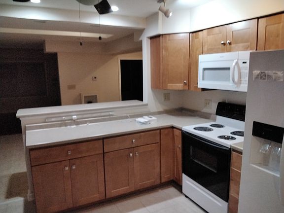 Kitchen counter top/ serving area with Range/ Refrigerator
