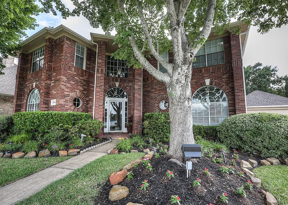 Incredible custom lake front home on a beautiful oversize corner lot