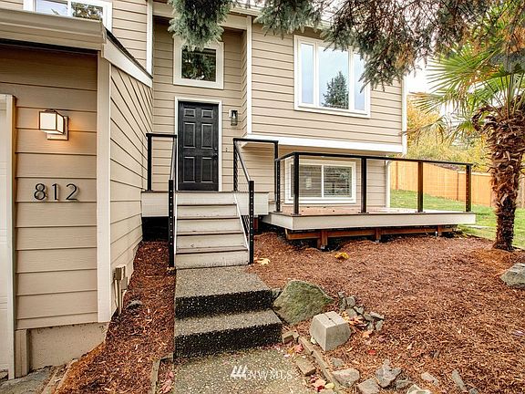 Great spot for a porch swing or bench. New railing and long lasting composite decking product!