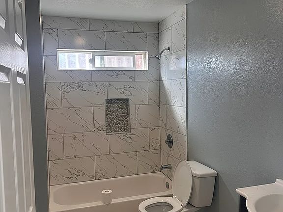 Remodeled updated bathroom, new light fixture with extractor built-in, new paint