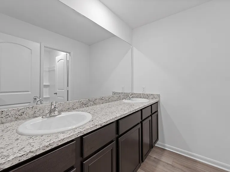 Dual sink vanity in the secondary bathroom.