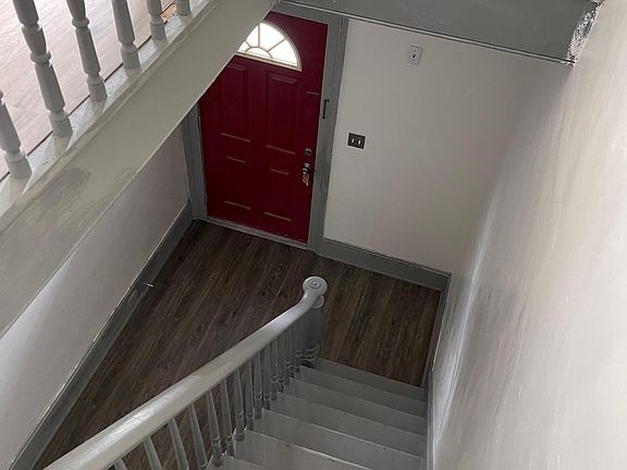 Entryway/Front door view from the top of the stairs