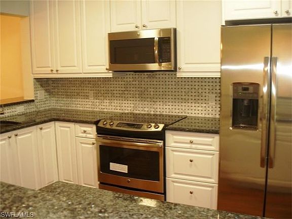 Blue Pearl Royal granite counters and custom tile backsplash make the kitchen a must have.