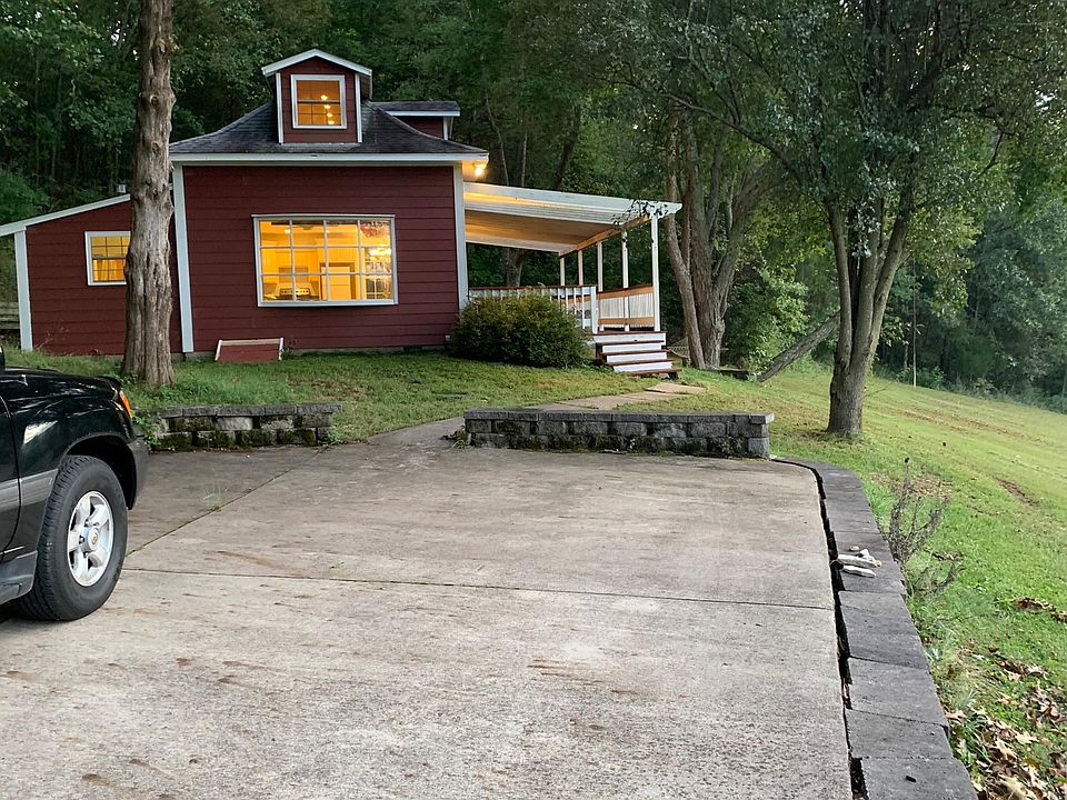 The house at the edge of the woods. Peaceful, quiet and serene surroundings. Private concrete drive. Parking space can accommodate 2-3 cars.