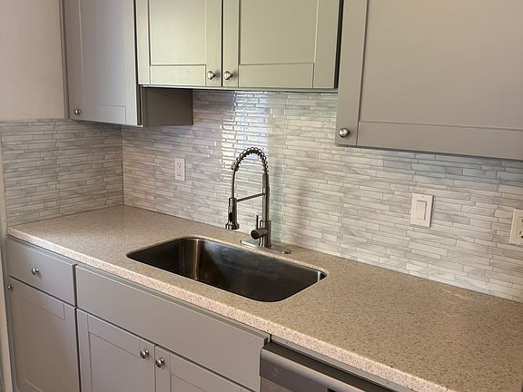 Brand new cabinets, countertops, backsplash, hardware, sink and faucet
